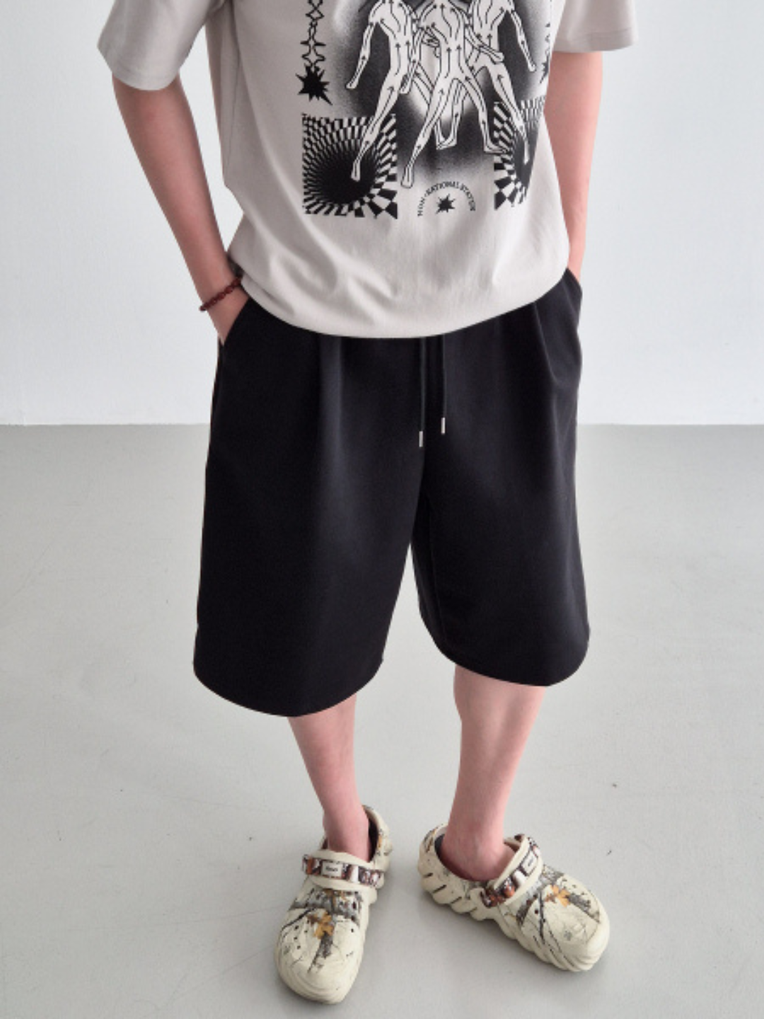 gray carpenter shorts with an elastic waistband and drawstring