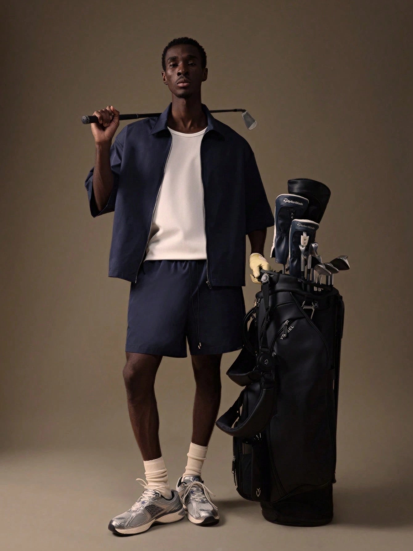 Model wearing the Auba Short Sleeve Shirt and Shorts Set in navy, matching outfit set