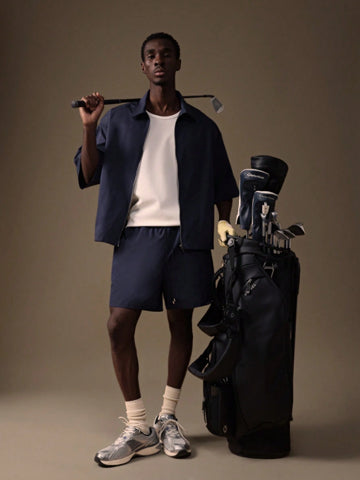 Model wearing the Auba Short Sleeve Shirt and Shorts Set in navy, matching outfit set