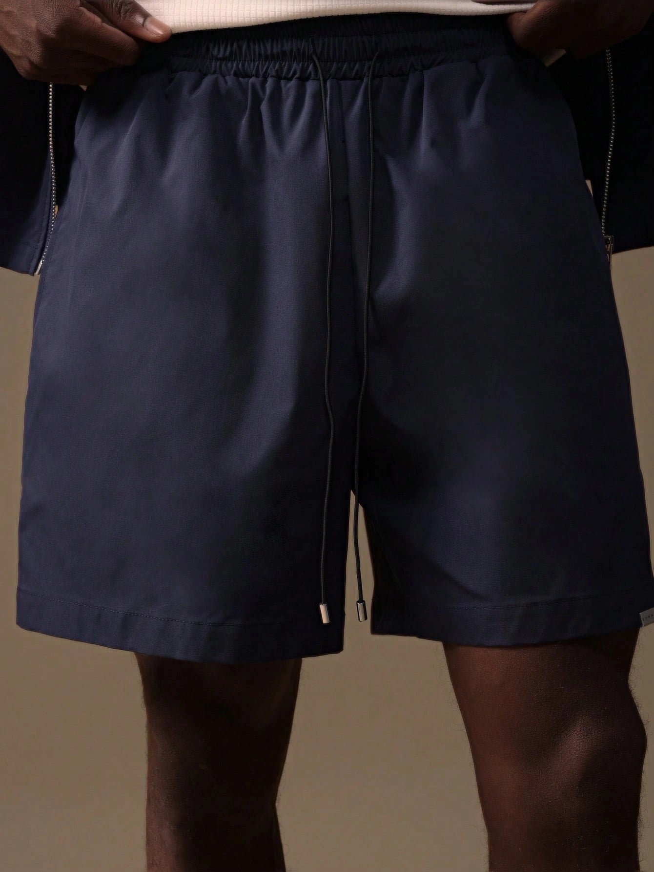 Model wearing the Auba Short Sleeve Shirt and Shorts Set in navy, matching outfit set