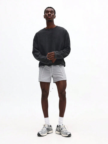 Person wearing white shorts with white stripes