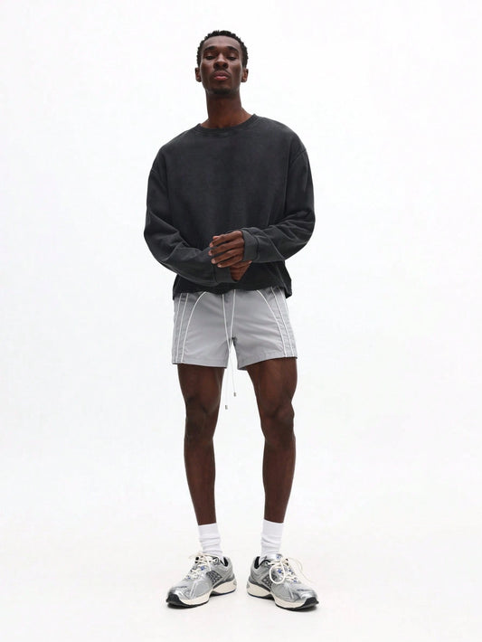 Person wearing white shorts with white stripes