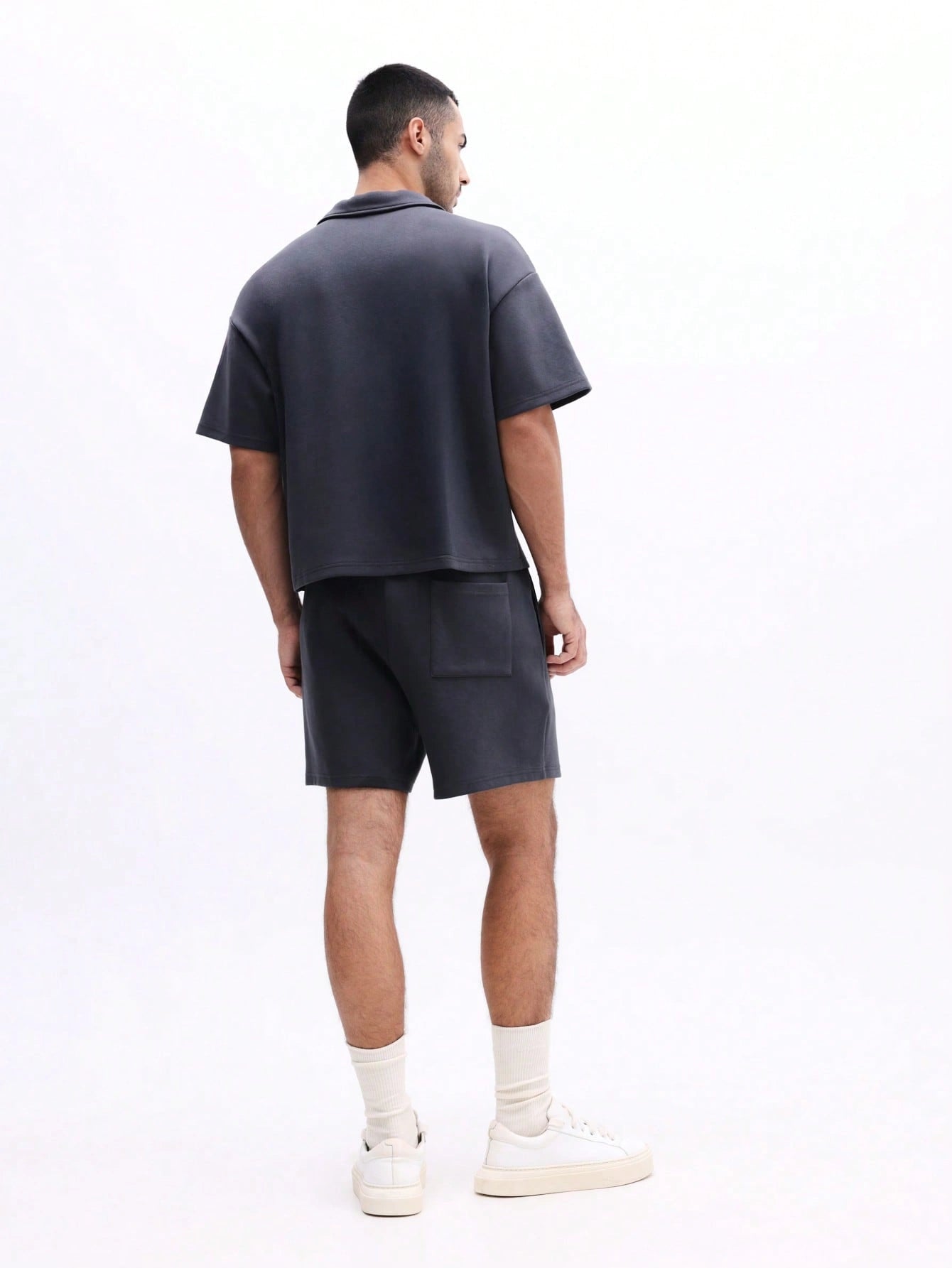 Man wearing Everdion's Collared Polo Top With Shorts Set in Navy color 