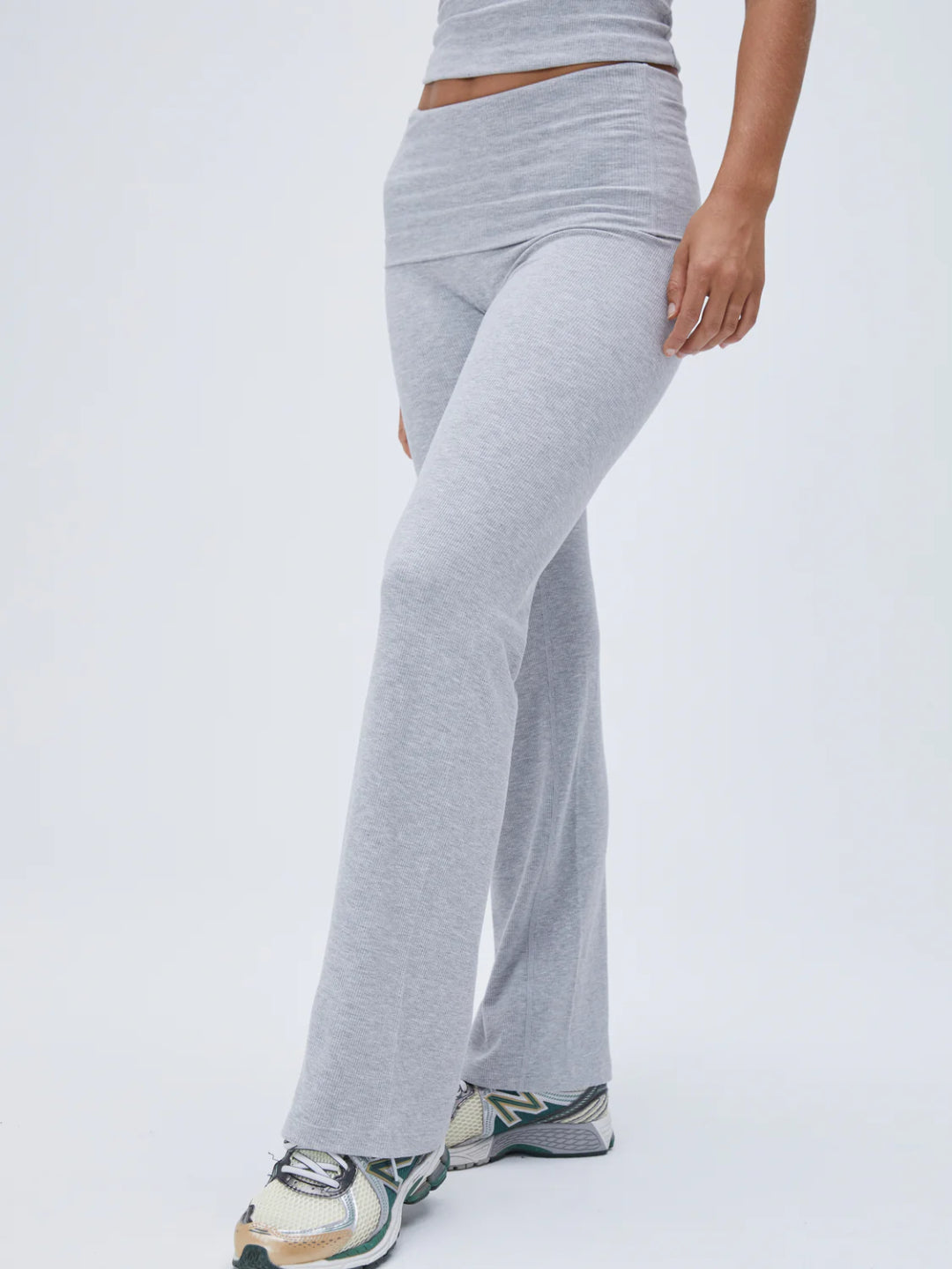 A pair of gray fold over pants with a raglan top, standing against a white background.