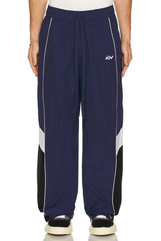 Navy blue pants with white and black accents on a white background