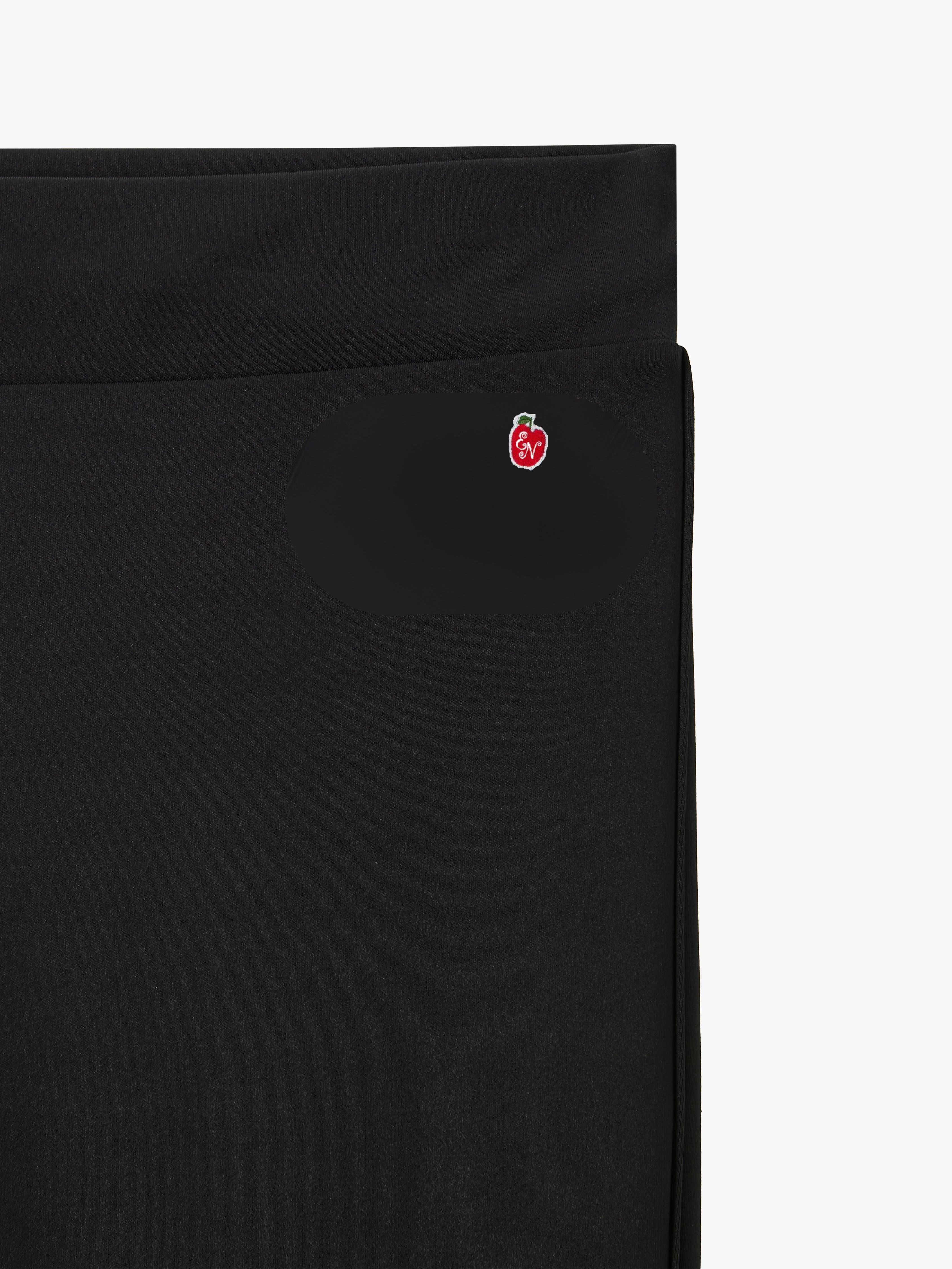 Black skirt with a small red logo on a white background