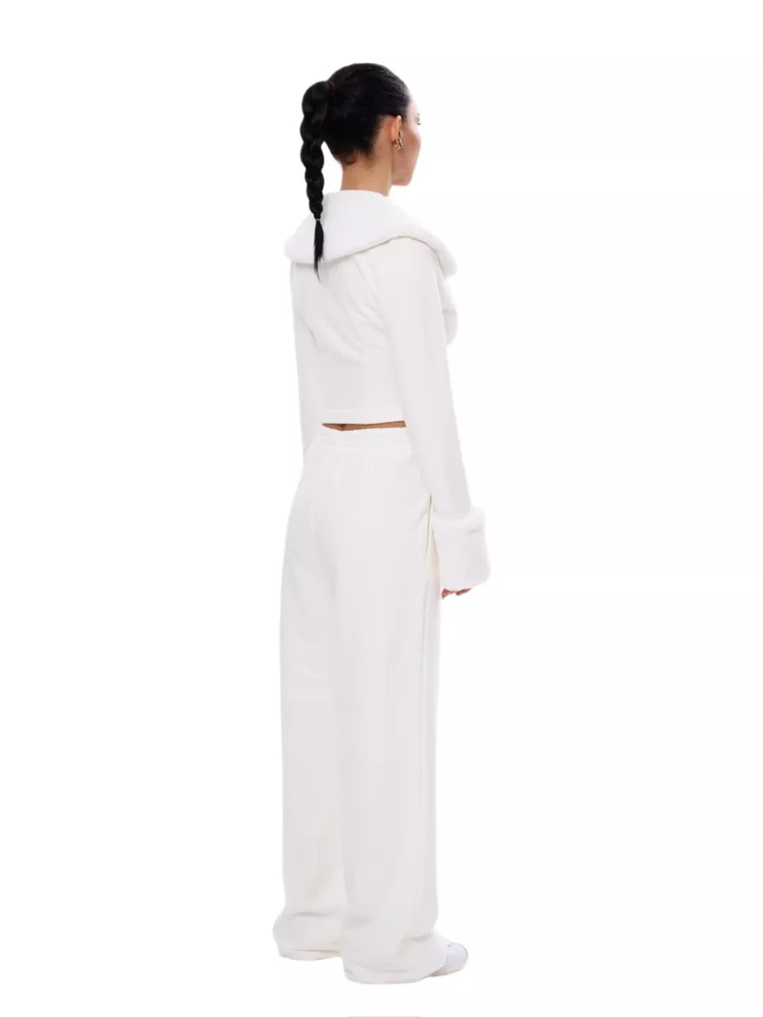 Person wearing a white outfit with a hood on a white background