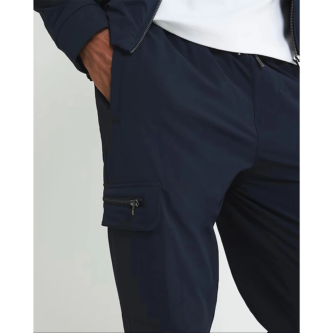 Navy blue pants with zippers on a light gray background