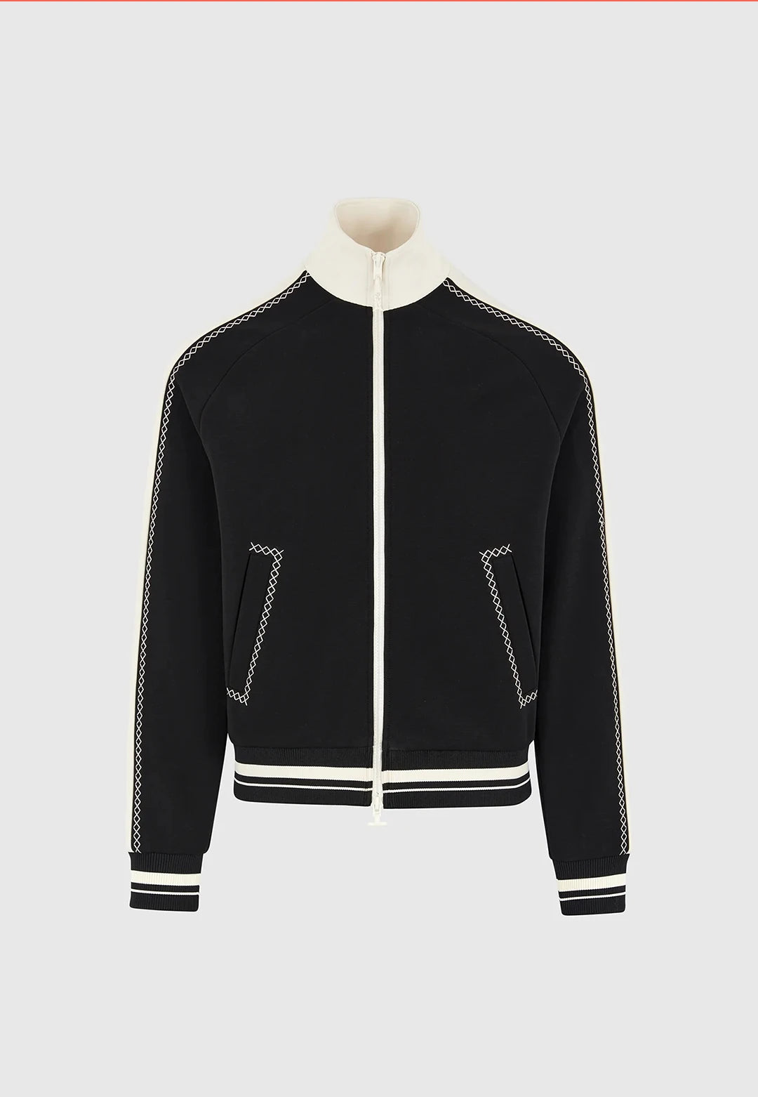 Black jacket with white trim on a light gray background