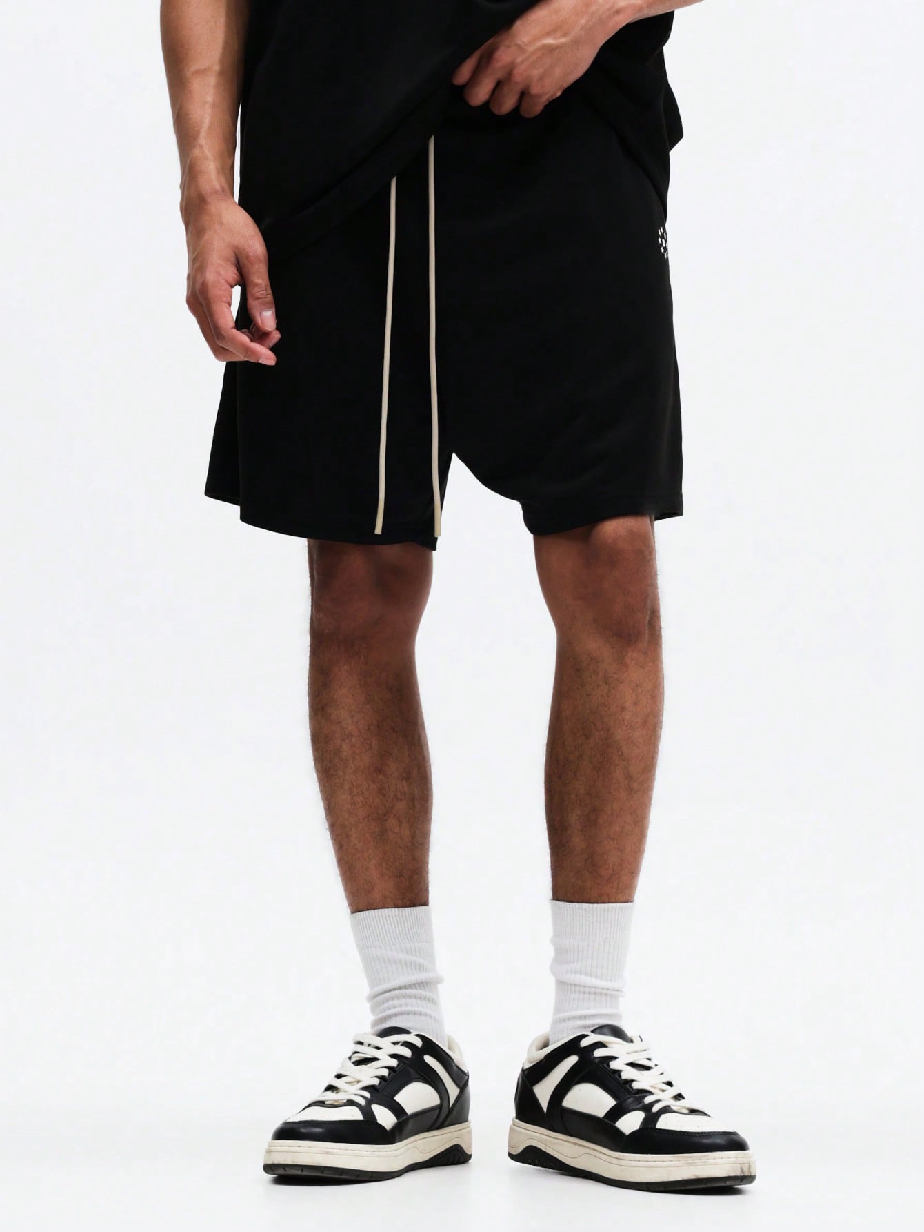 The Nitro T-Shirt and Shorts Set is designed in black for effortless style, comfort, and everyday versatility. Crafted from soft, breathable fabric, it features a relaxed-fit oversized tee paired with coordinating shorts.