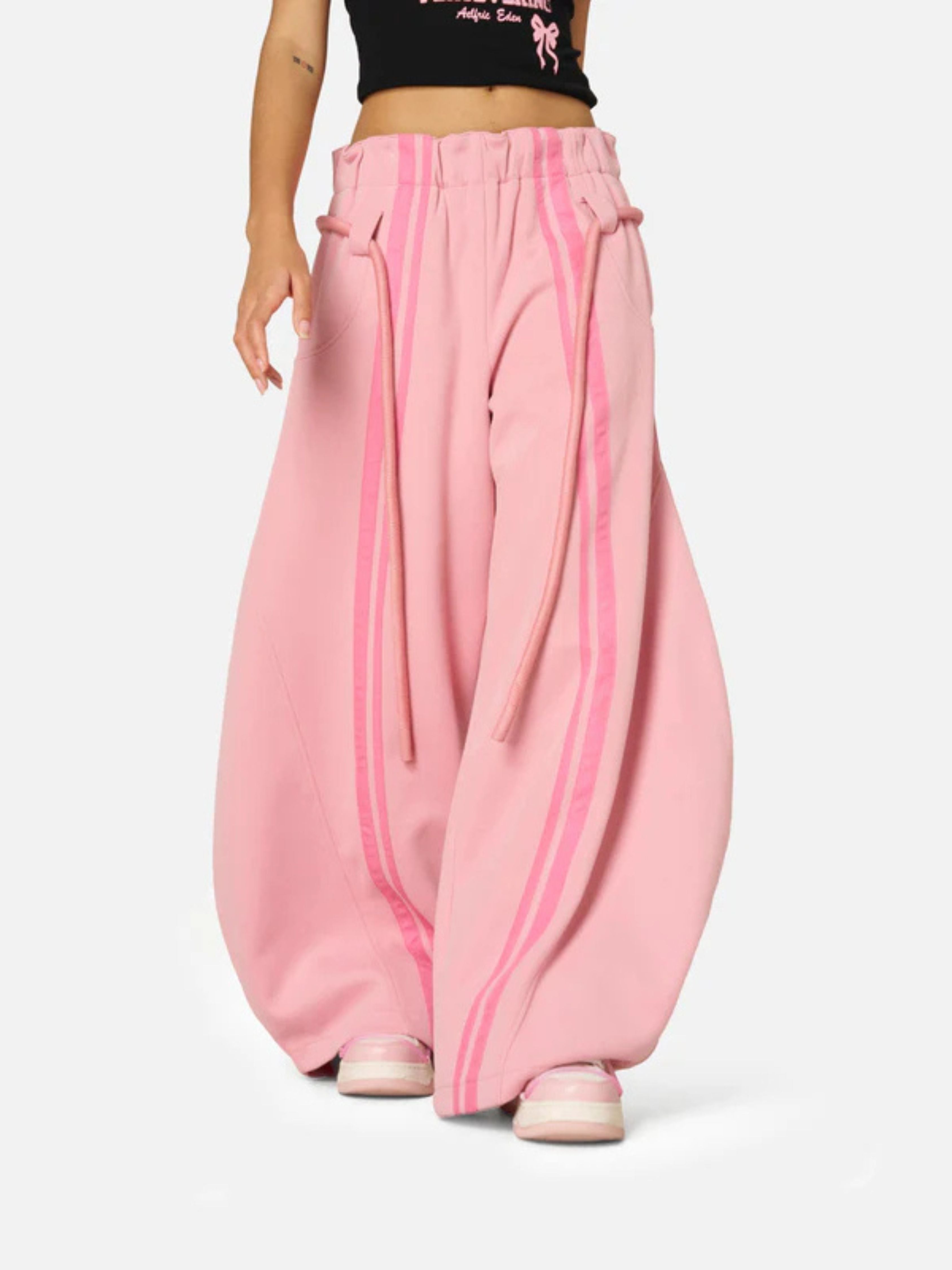 Pink wide-leg pants with a white background