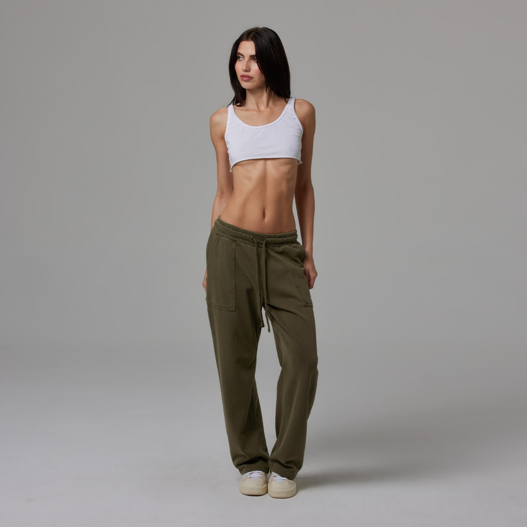 Olive jersey carpenter sweatpants with an adjustable toggle hem at the ankle, featuring multiple pockets.