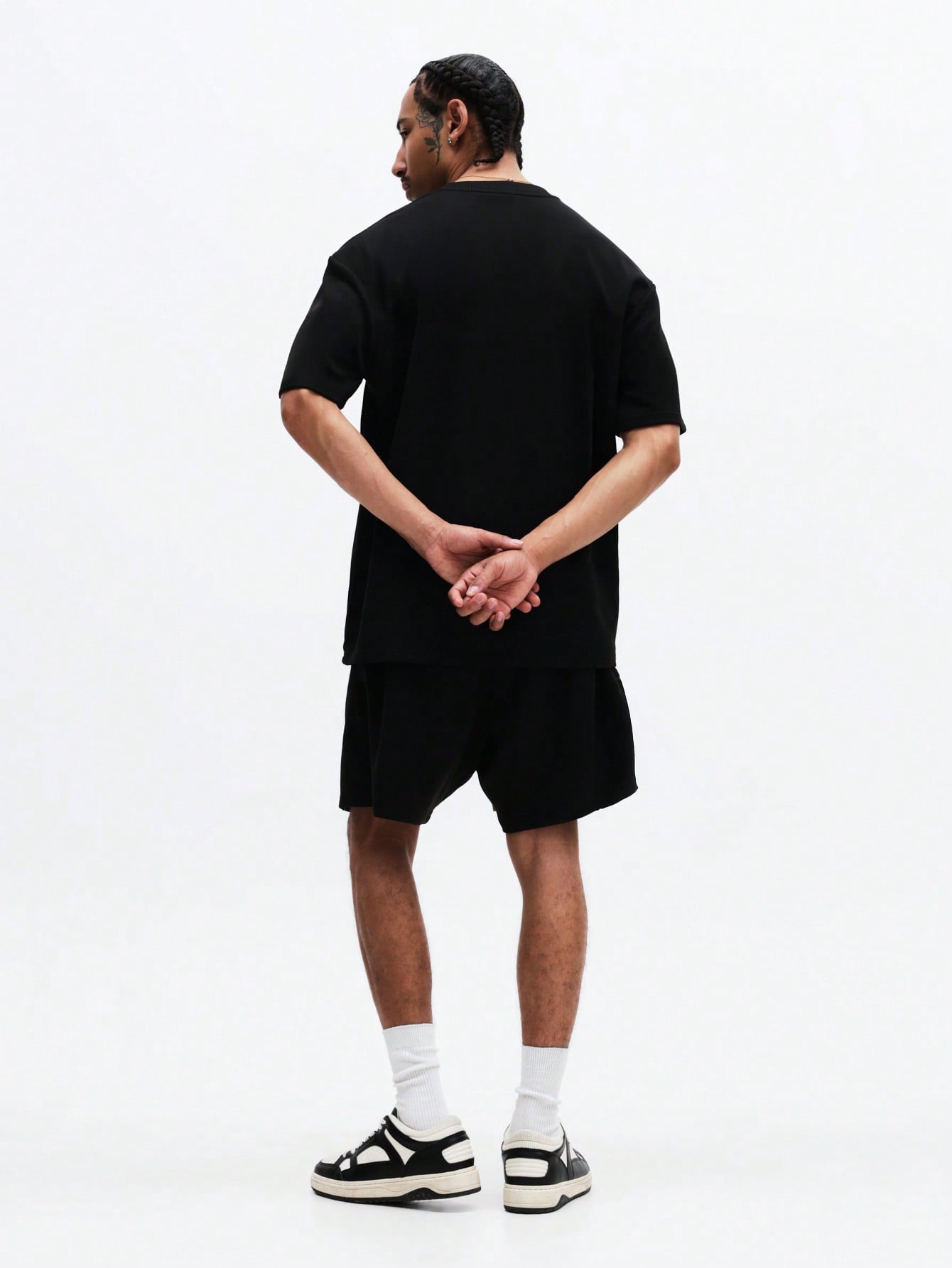 The Nitro T-Shirt and Shorts Set is designed in black for effortless style, comfort, and everyday versatility. Crafted from soft, breathable fabric, it features a relaxed-fit oversized tee paired with coordinating shorts.