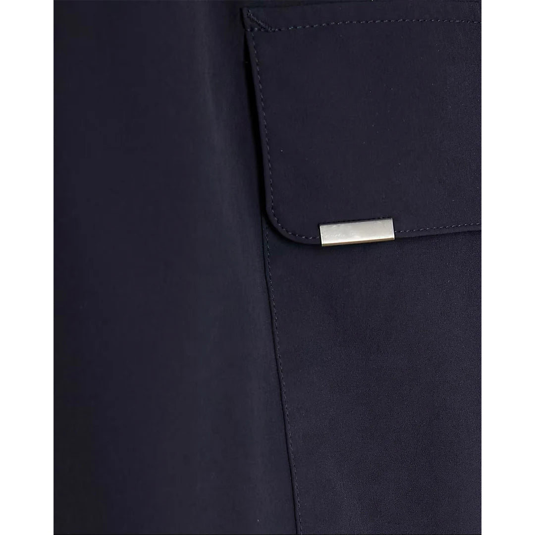 Navy blue pants with a silver patch on a white background