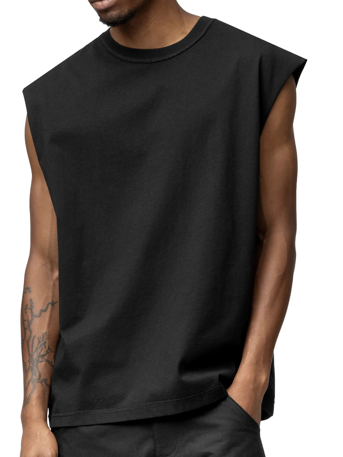 Black sleeveless shirt worn by a person on a white background