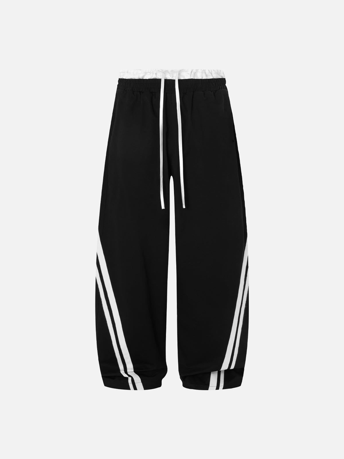 Black pants with white stripes on a light grey background