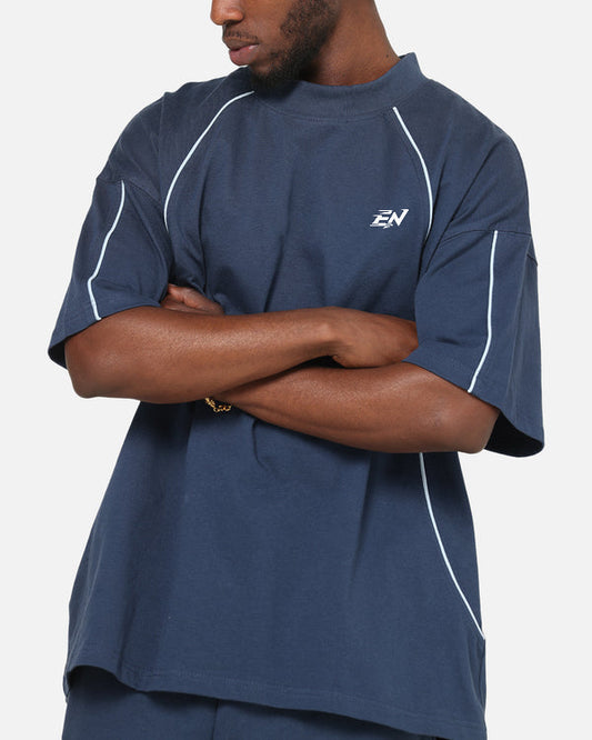 Person wearing a navy blue athletic outfit with a logo on a white background