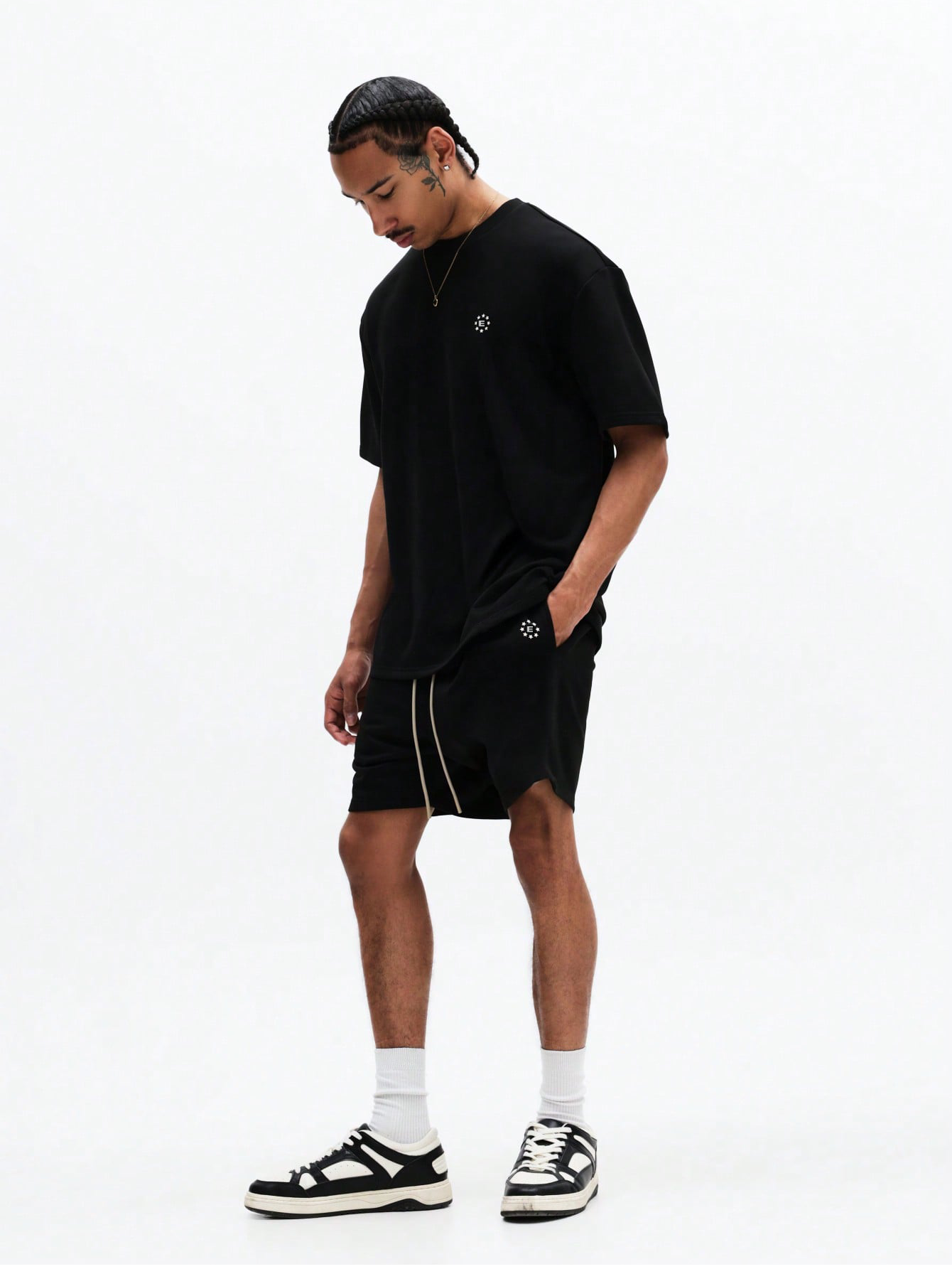 The Nitro T-Shirt and Shorts Set is designed in black for effortless style, comfort, and everyday versatility. Crafted from soft, breathable fabric, it features a relaxed-fit oversized tee paired with coordinating shorts.
