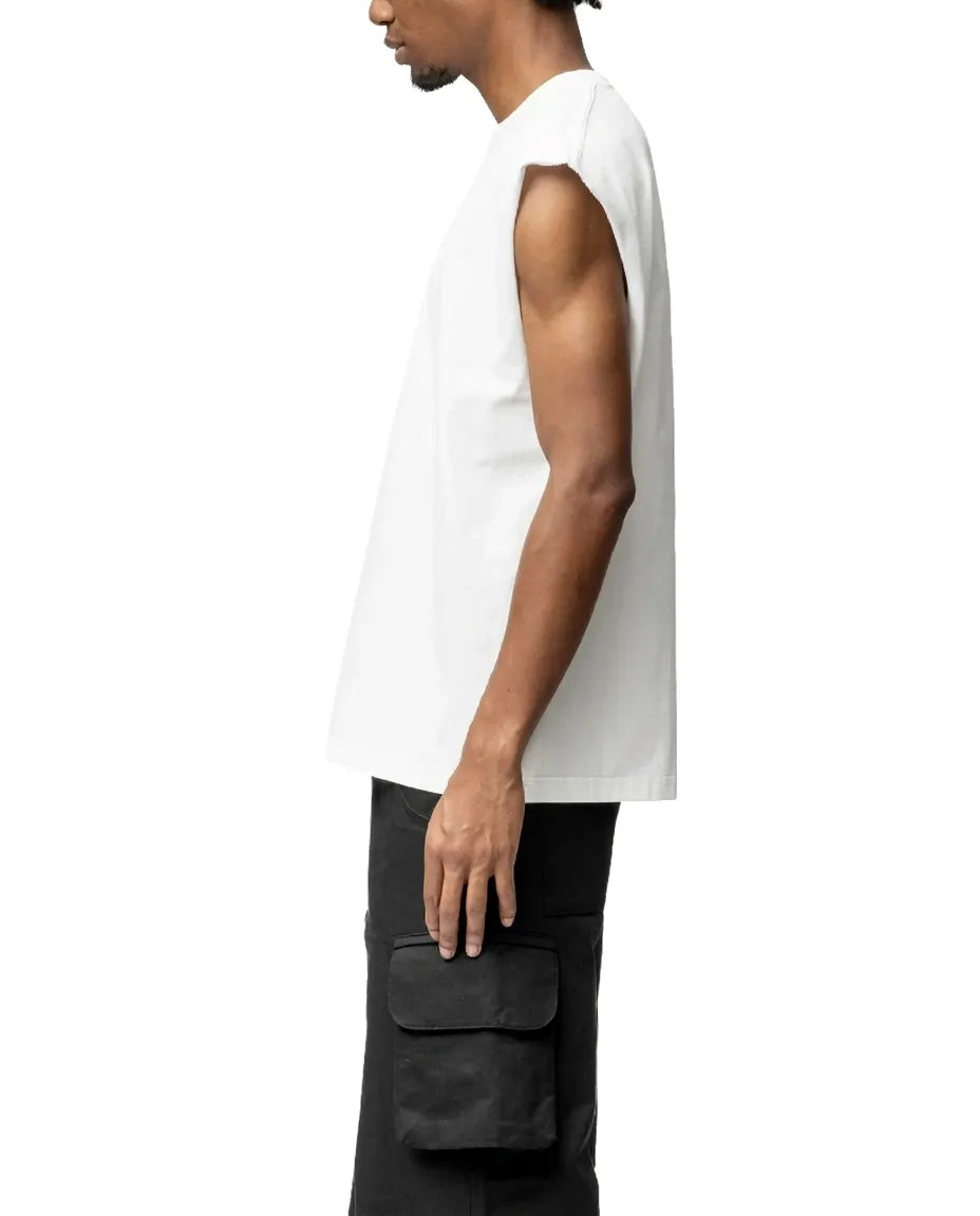Person wearing a white sleeveless shirt and black pants on a white background