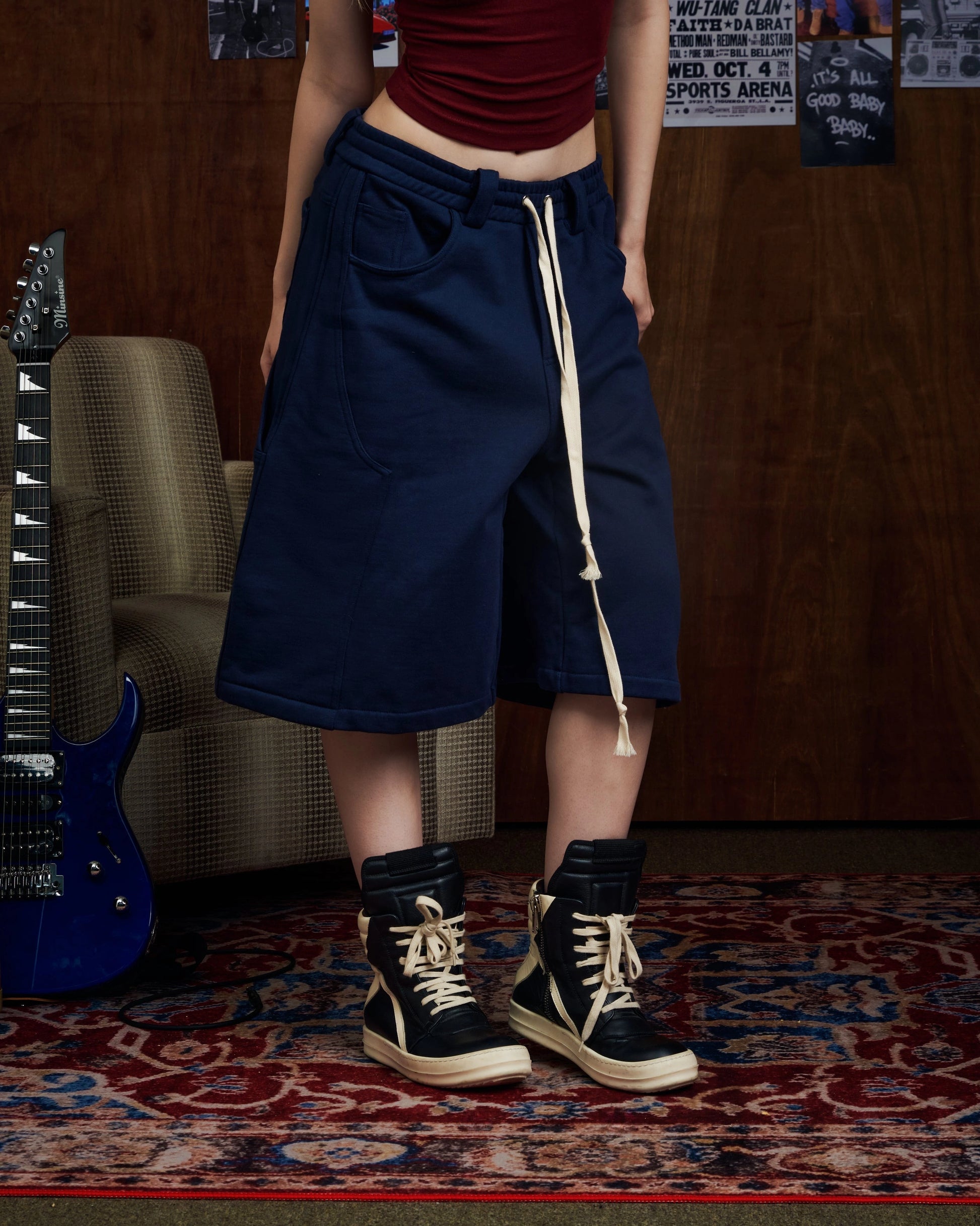 Oversized navy carpenter shorts with elastic drawstring waist and wide-leg fit