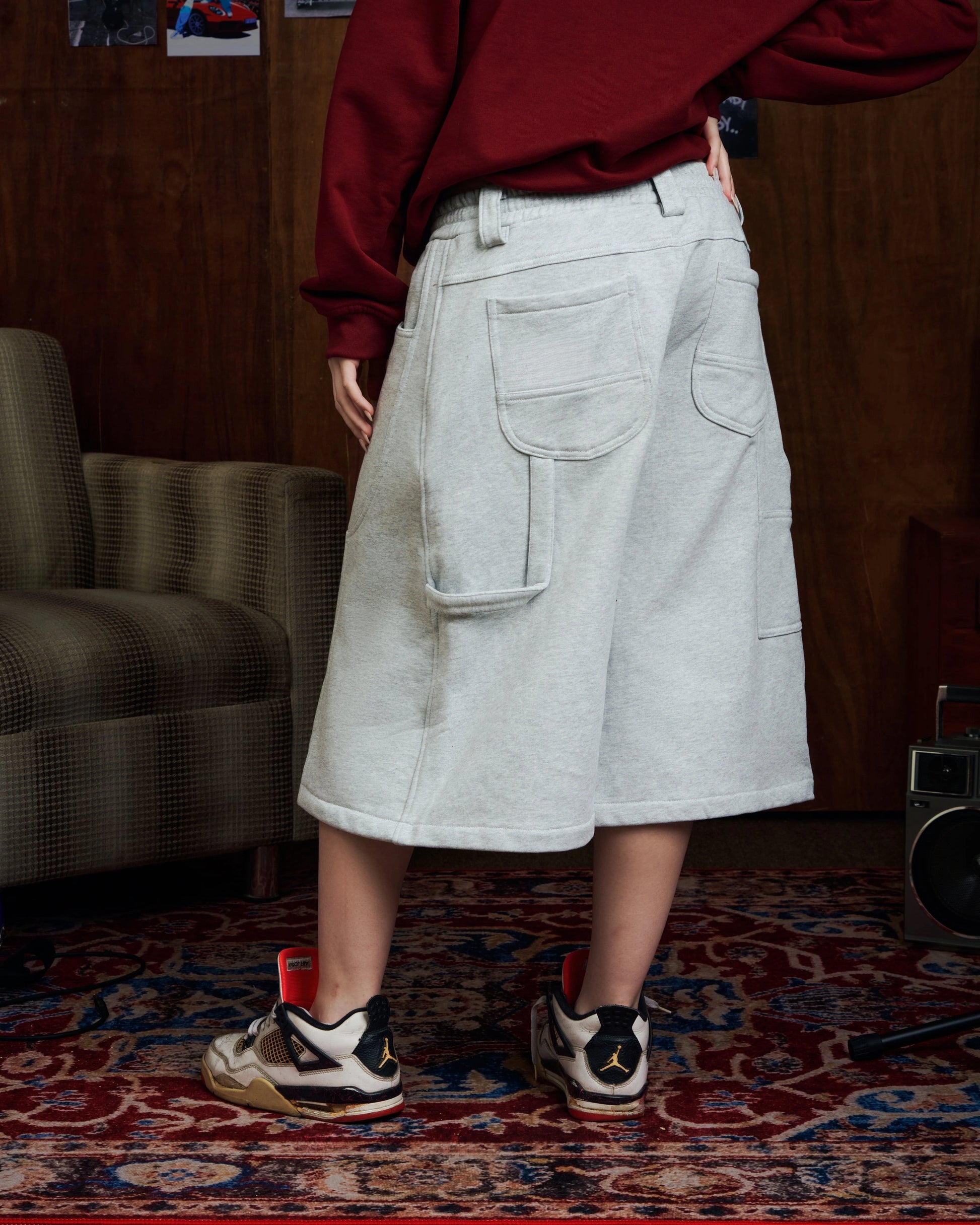 Oversized grey carpenter shorts with elastic drawstring waist and wide-leg fit