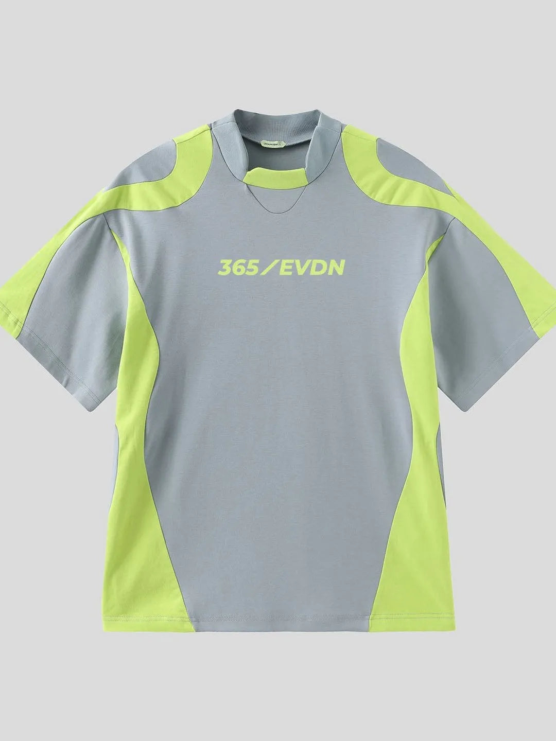 Grey and green athletic shirt with '365/EVDN' branding on a light gray background