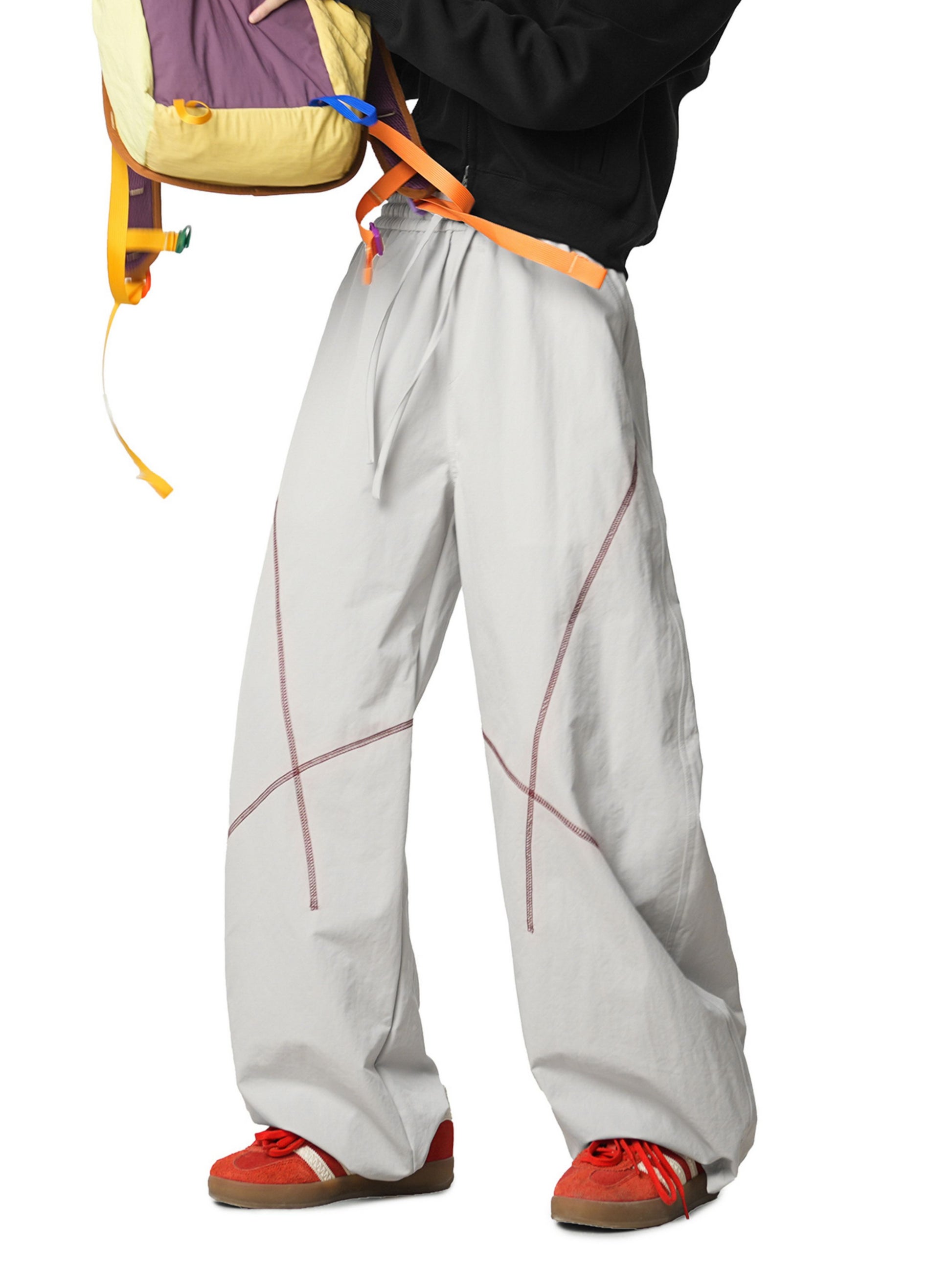 Grey Pants with Contrast stitching enhances the silhouette, adding subtle detail without compromising a clean look. Finished with practical pockets and a versatile design, these pants are ideal for casual outfits, travel, and athleisure wear.