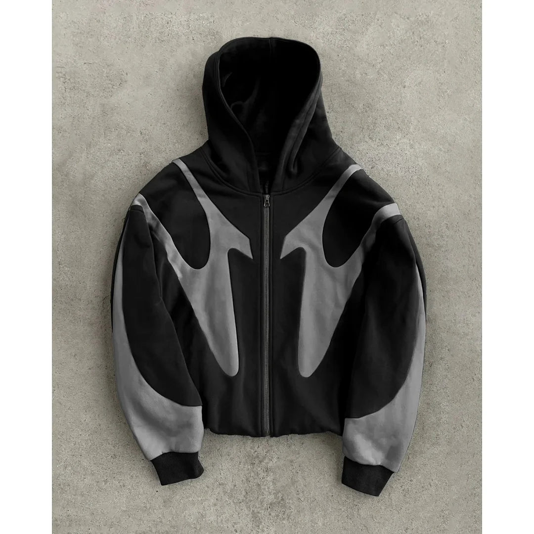 Black and gray hoodie on a textured surface
