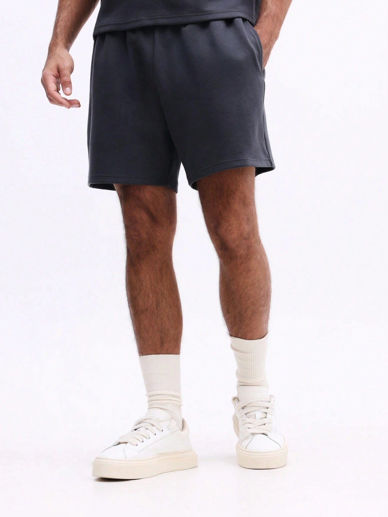 Man wearing Everdion's Collared Polo Top With Shorts Set in Navy color 