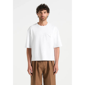 Man wearing a white t-shirt and brown pants on a white background