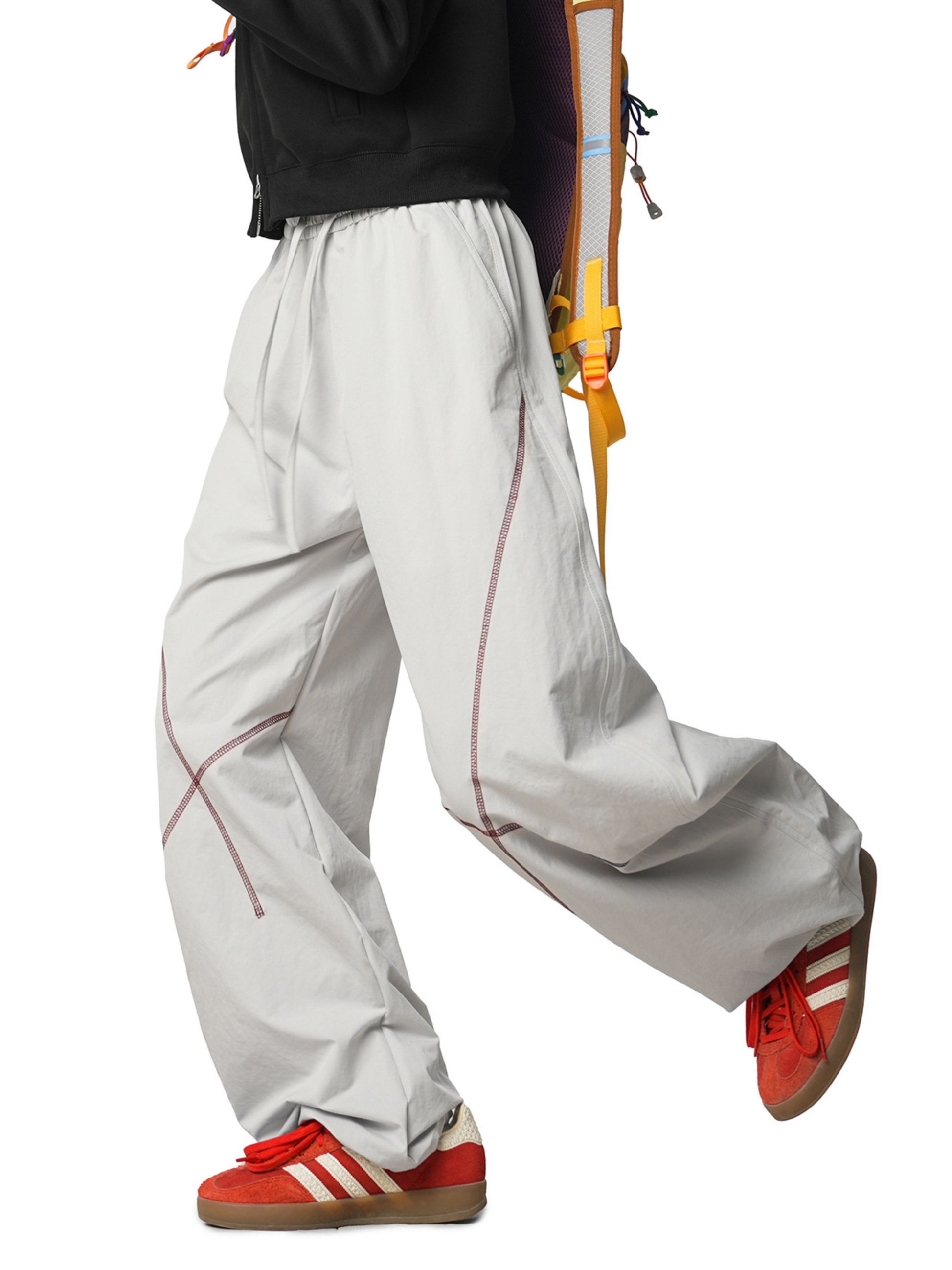 Grey Pants with Contrast stitching enhances the silhouette, adding subtle detail without compromising a clean look. Finished with practical pockets and a versatile design, these pants are ideal for casual outfits, travel, and athleisure wear.