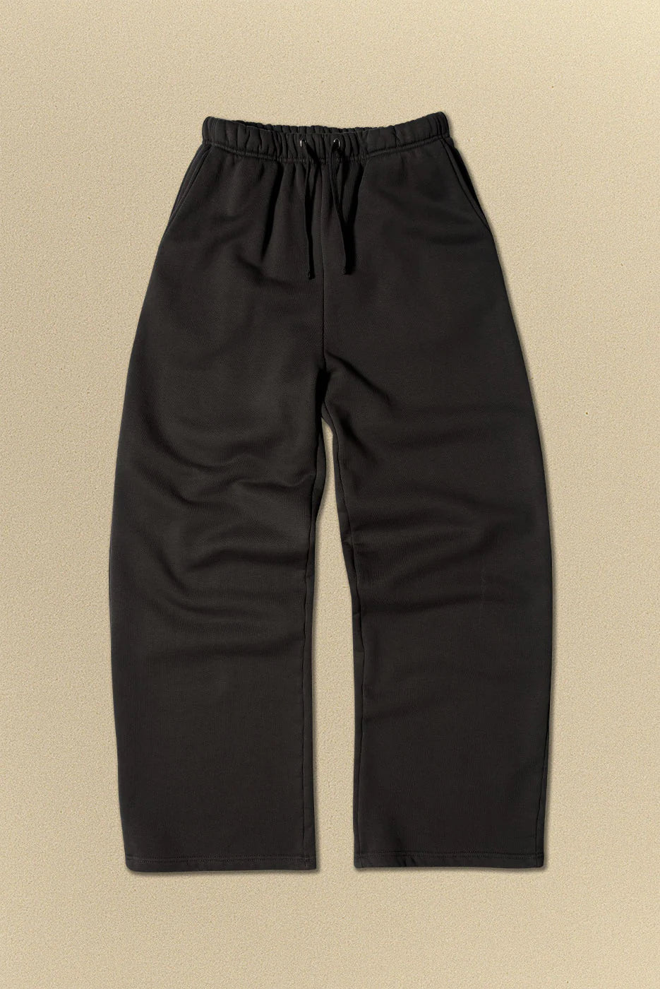Black pants on a beige background