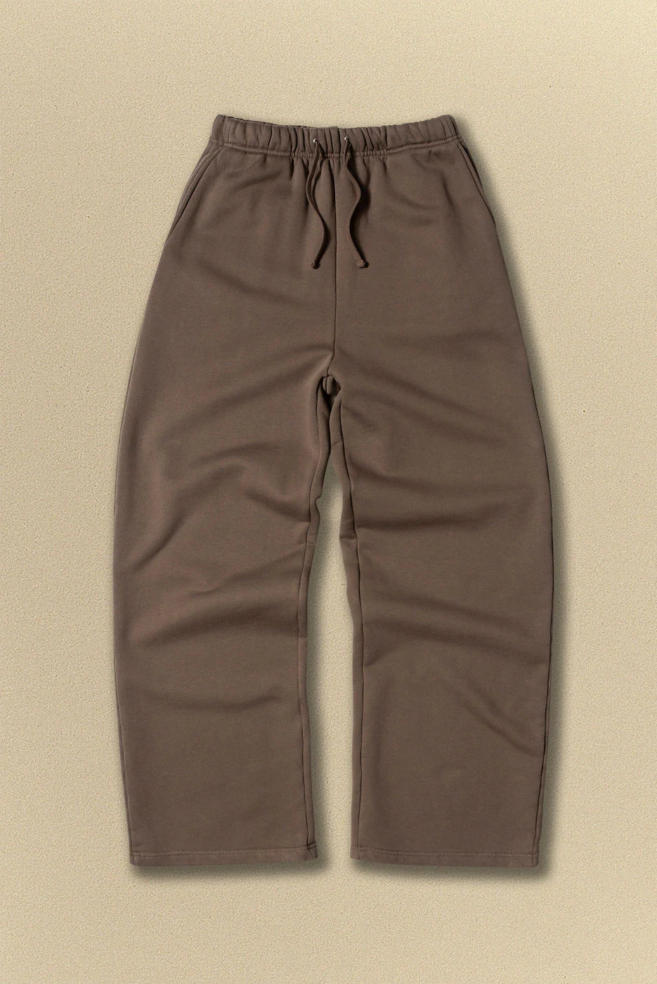 Brown pants on a beige background