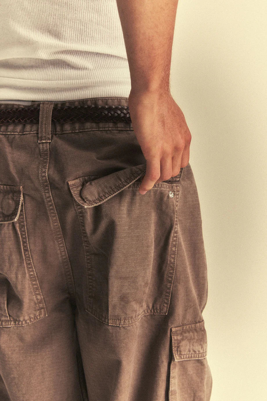 Brown pants with a neutral background