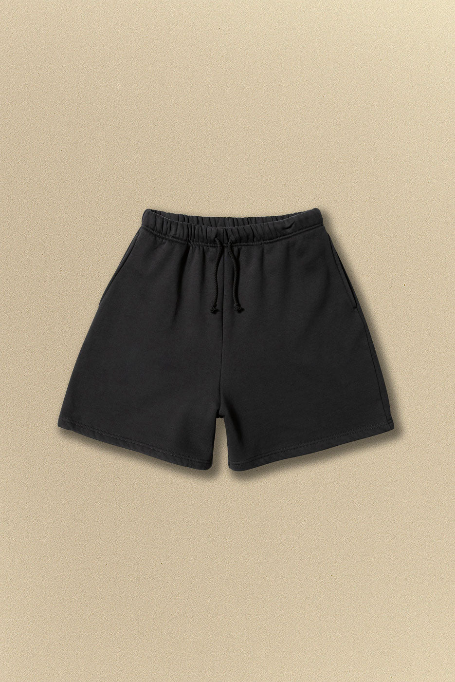 Black shorts on a beige background