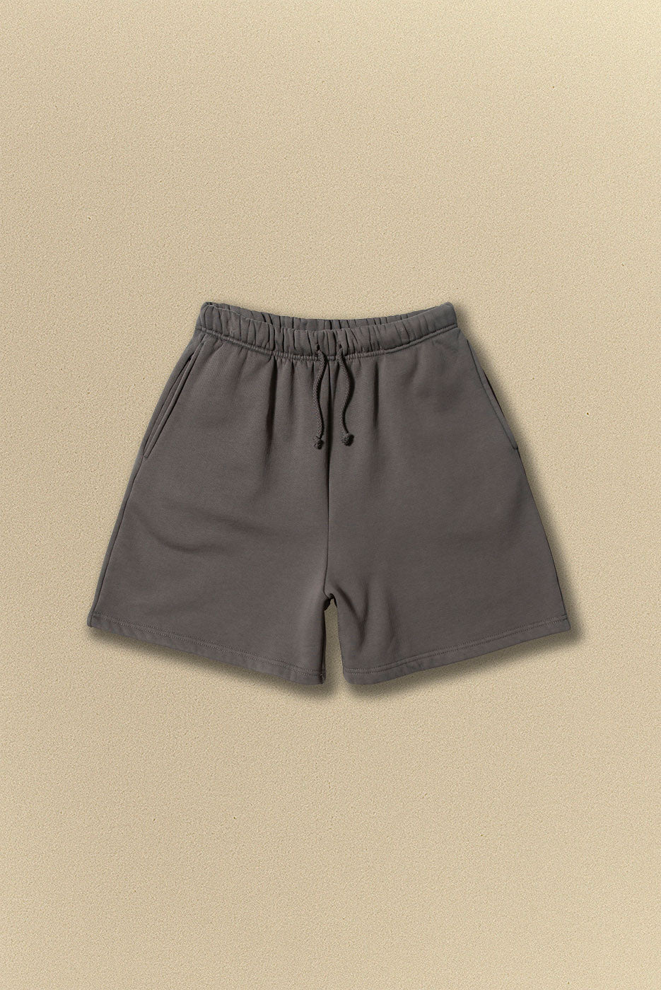 Grey shorts on a beige background