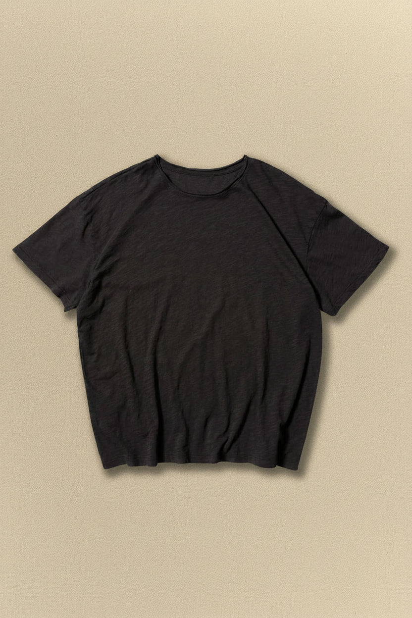Black t-shirt on a beige background
