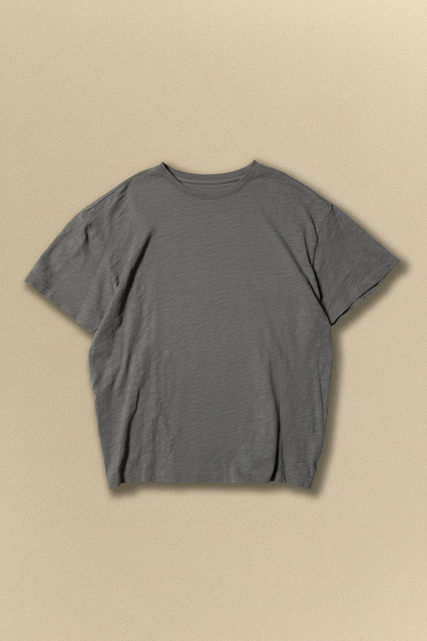 Grey t-shirt on a beige background