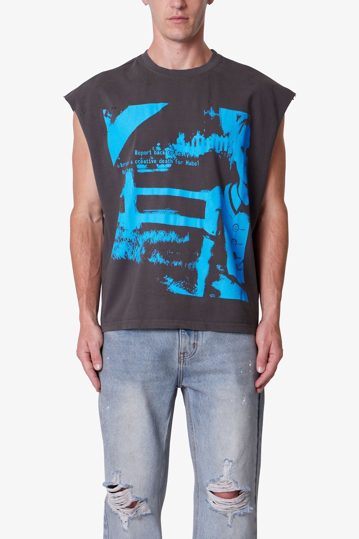 Person wearing a sleeveless black shirt with blue graphic design and light blue jeans.