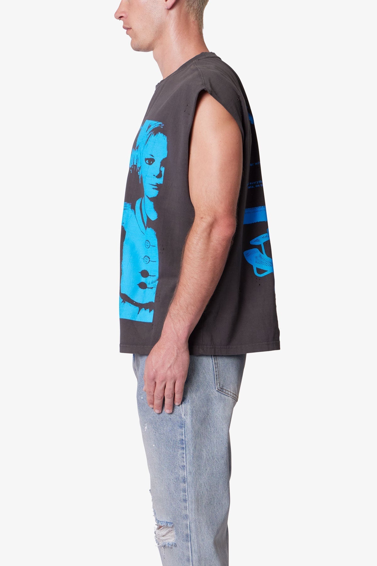 Person wearing a sleeveless shirt with blue graphic design on a white background