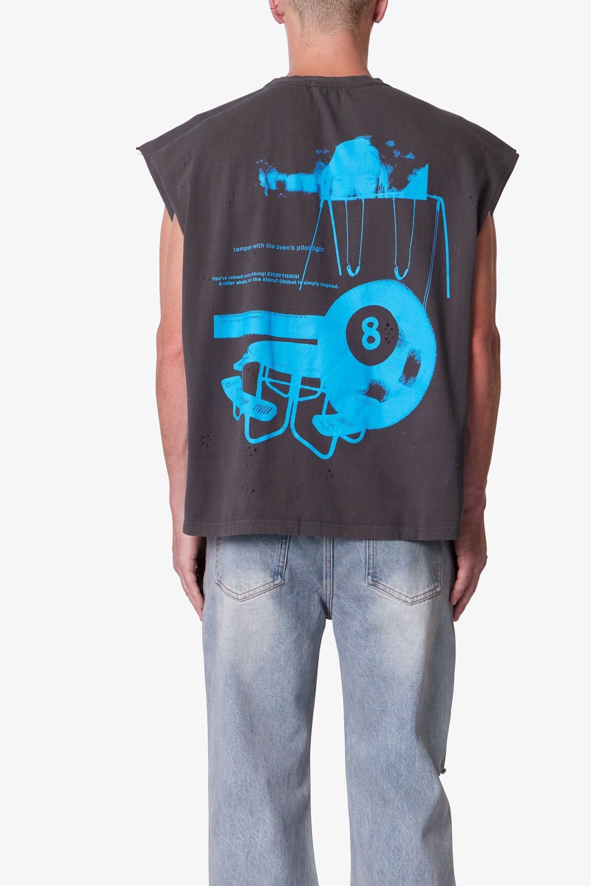 Person wearing a sleeveless shirt with blue graphic design on the back