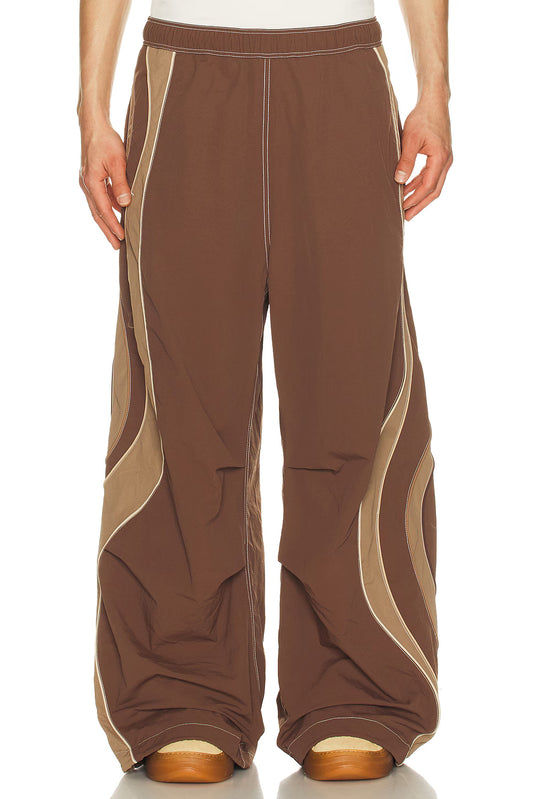 Brown wide-leg pants with beige accents on a white background