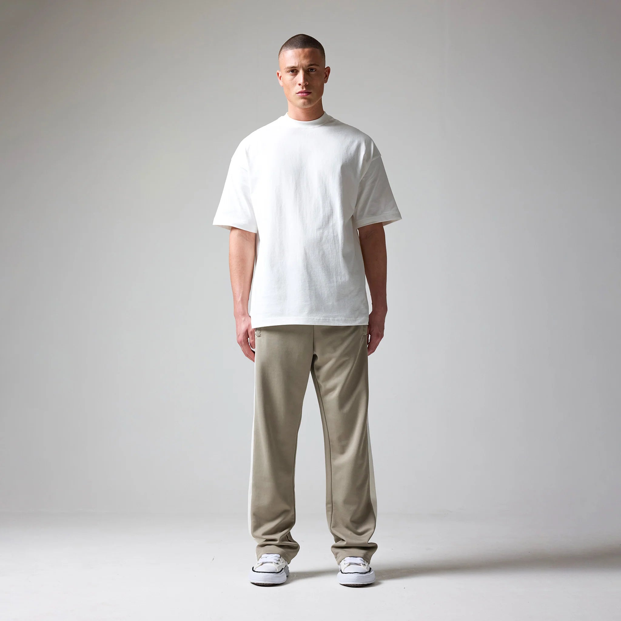 Pants worn by a person on a plain background