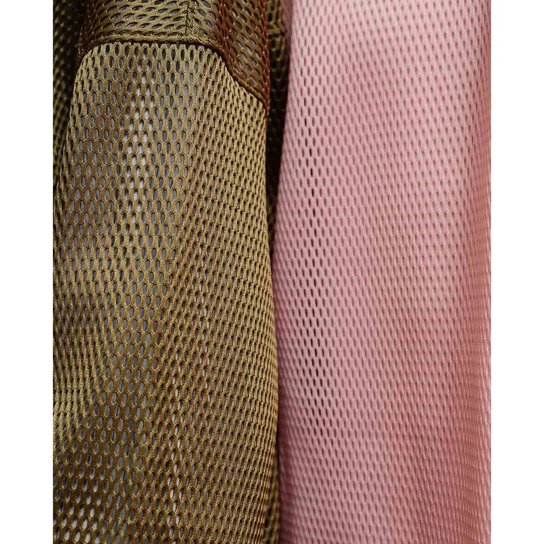 Close-up of two textured fabrics, one brown and one pink, on a white background.