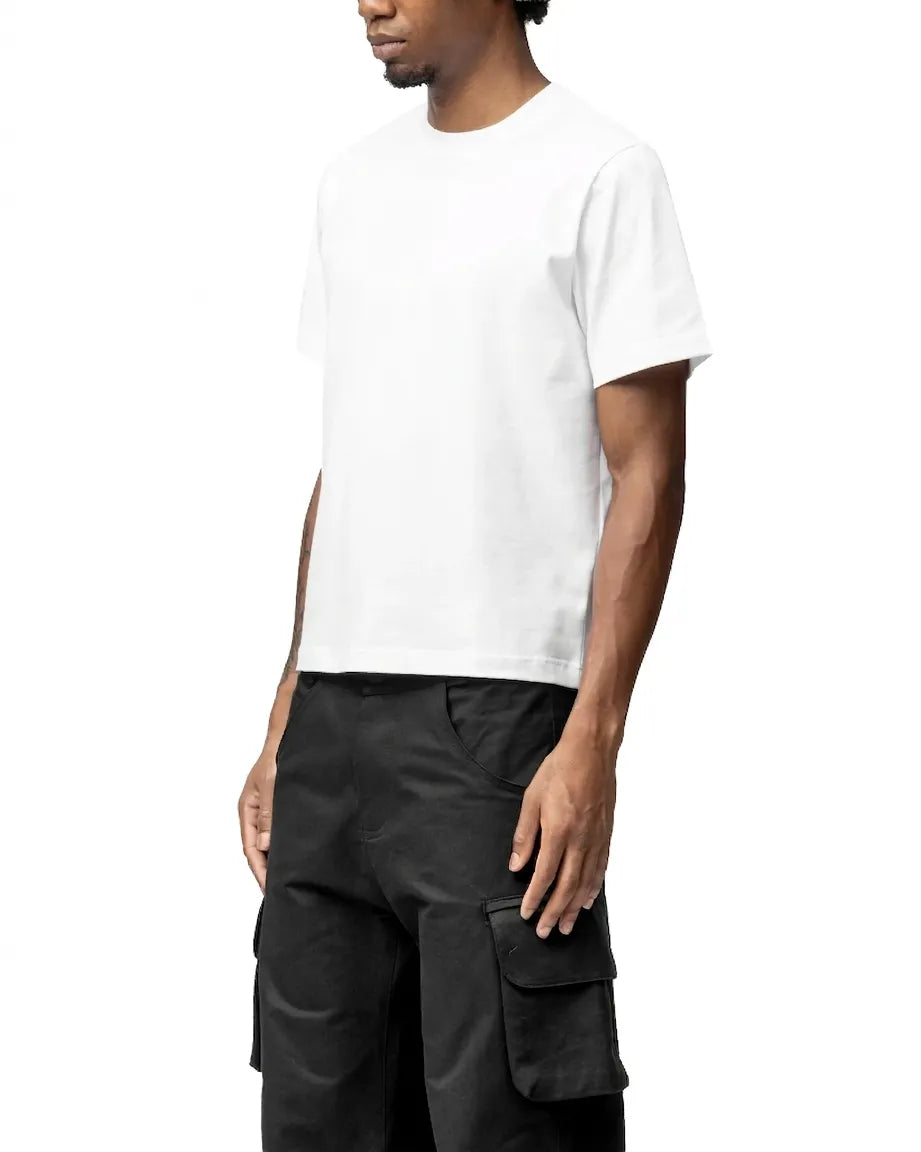 Person wearing a white t-shirt and black cargo pants on a white background