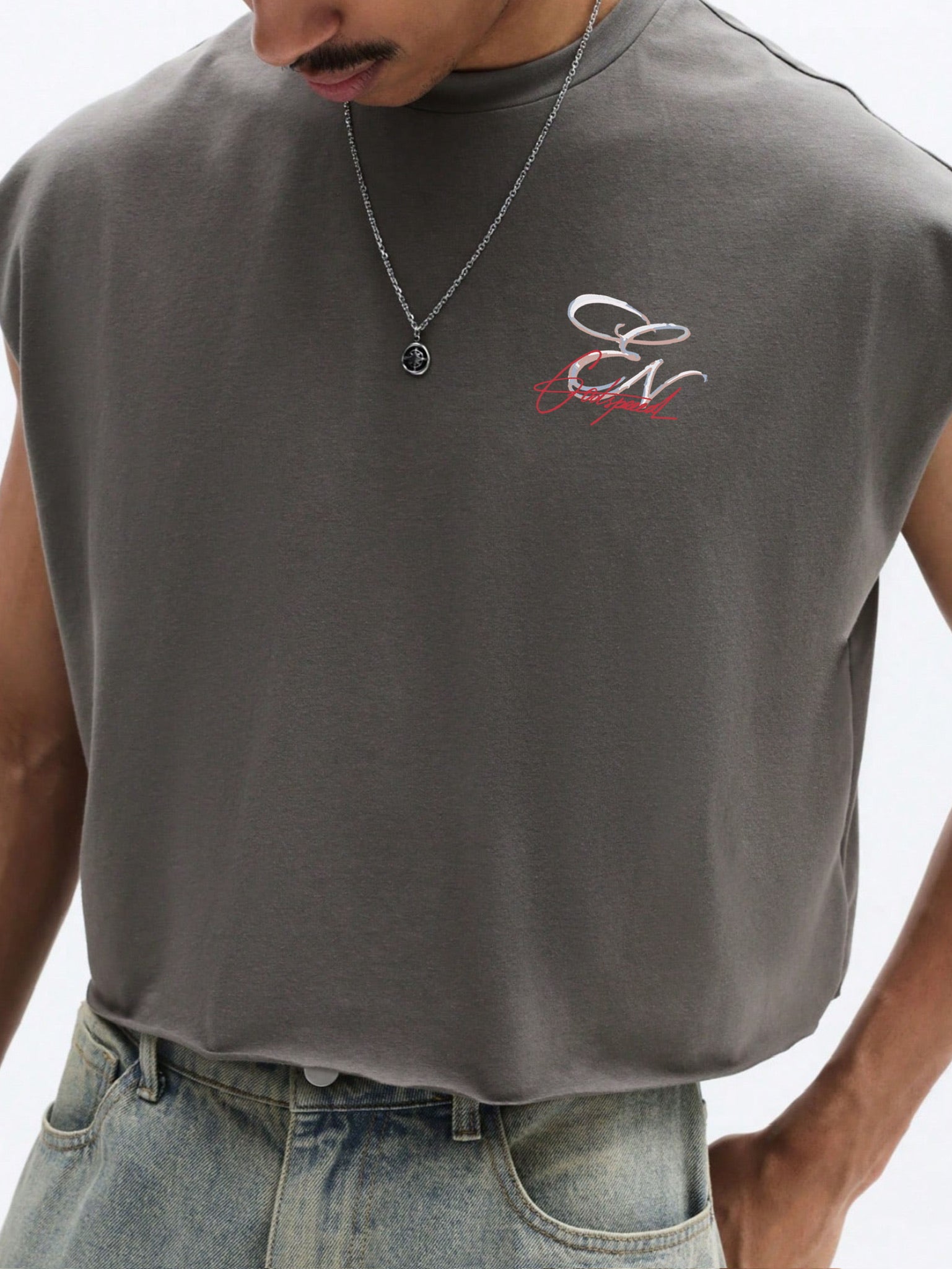 Man wearing a sleeveless grey shirt with Everdion logo on a white background