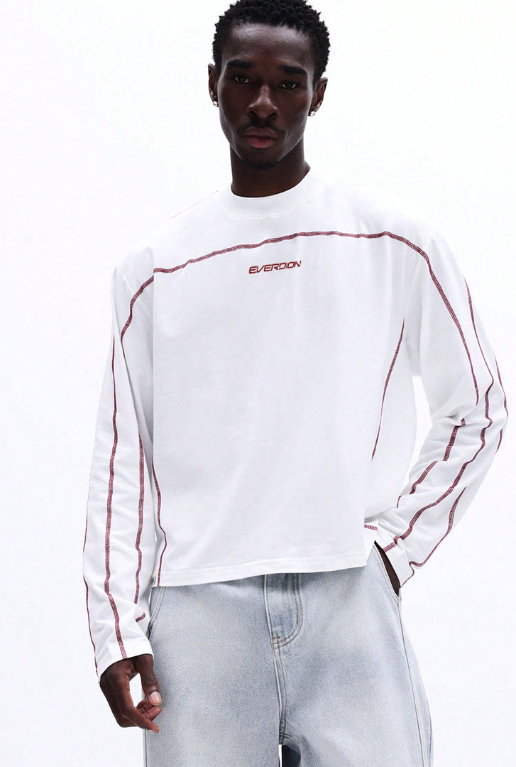 Person wearing a white long-sleeve shirt with red accents and 'EVERDION' branding.