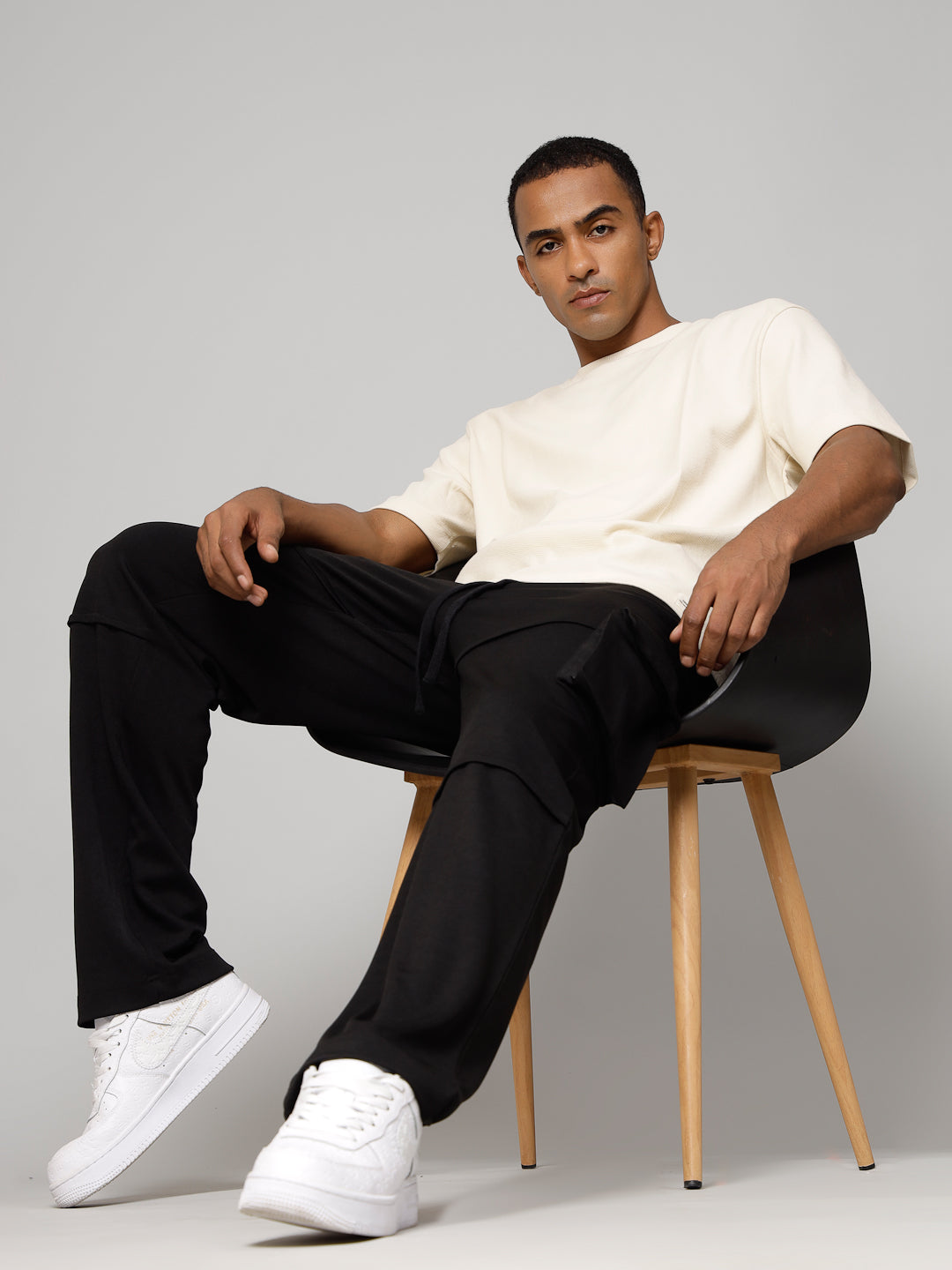 Black Cargo straight-leg pants with large side flap pockets 