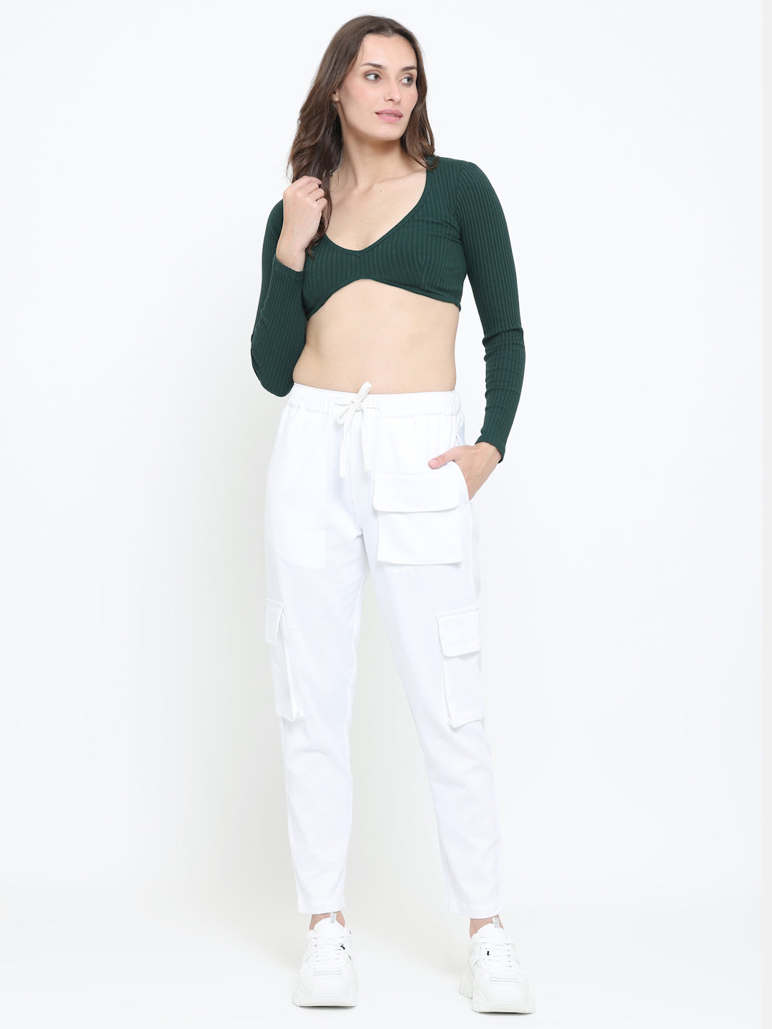 A model wearing white utility cargo pants with large side flap pockets and a drawstring waistband.