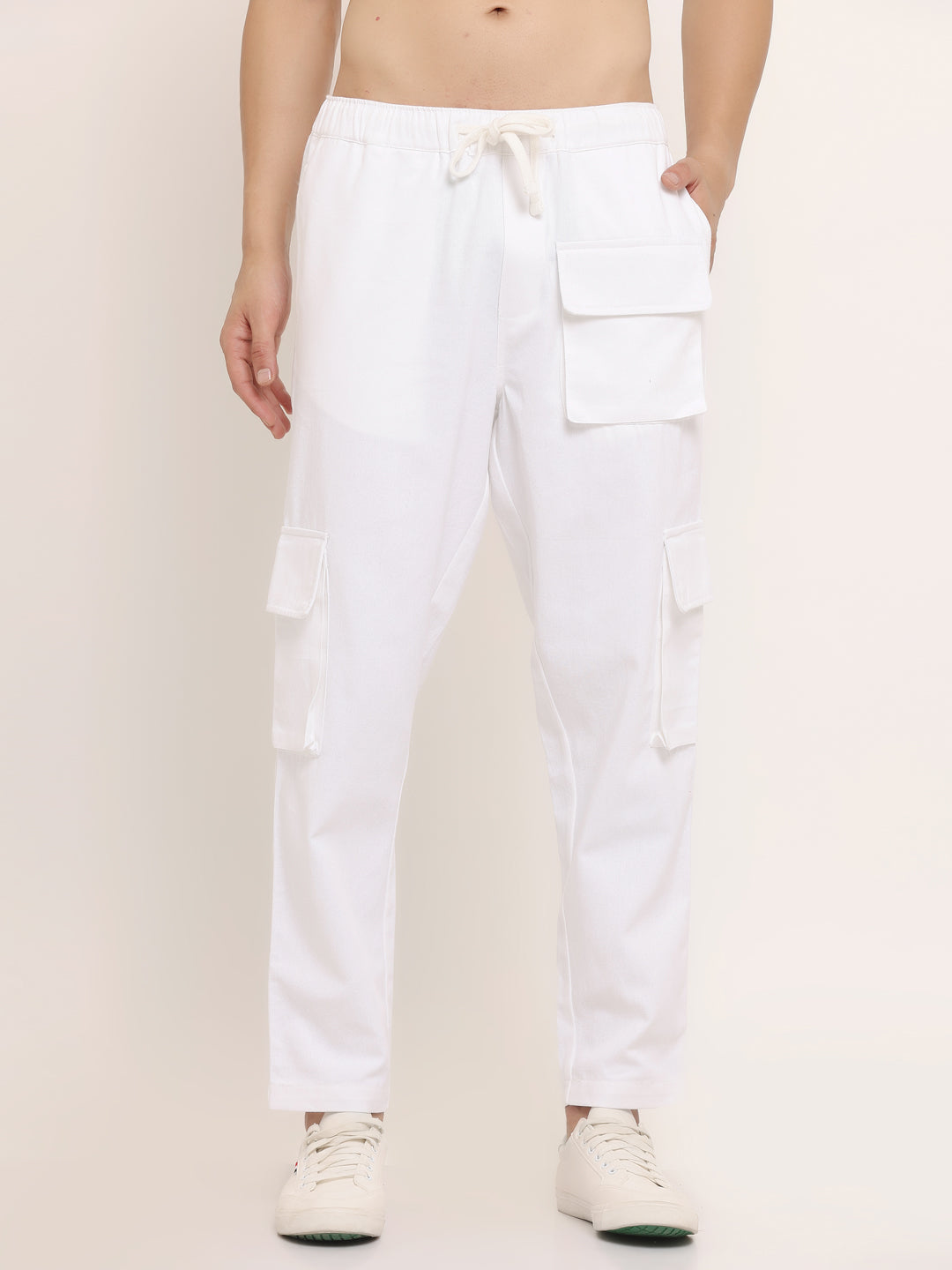 A white slim-fit cargo pants with multiple pockets, featuring an elasticated waistband with a drawstring.